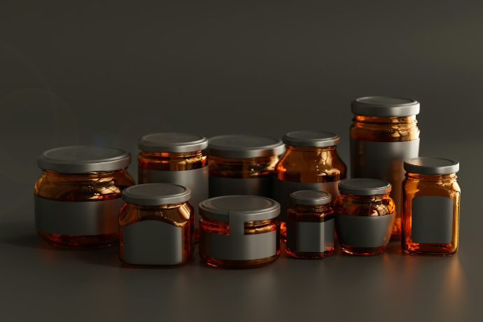 a group of jars with lids on a table